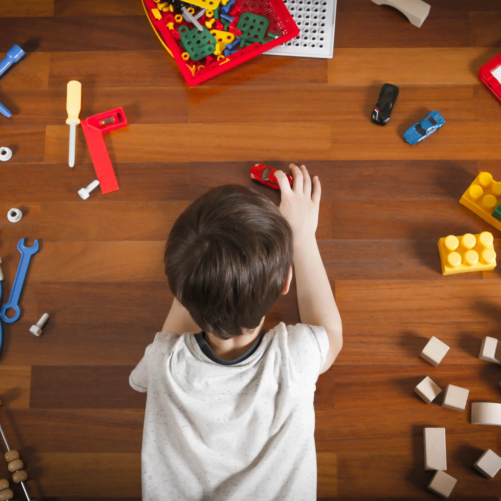 Kid playing with toys | Leaf Floor Covering